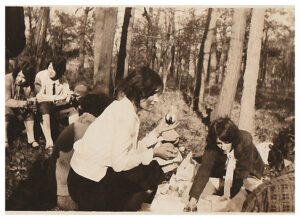 A group of people in the woods with trees